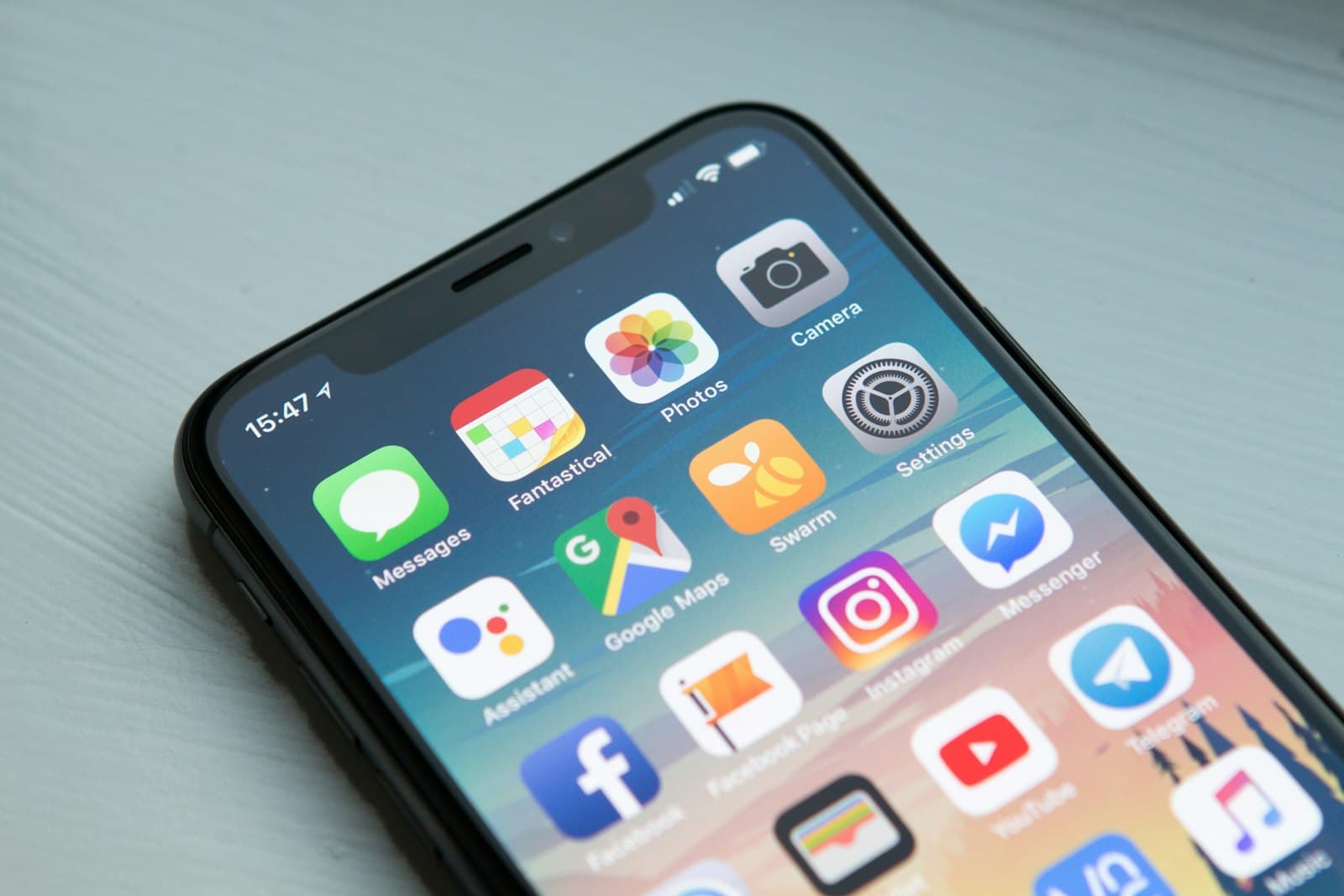 A close crop of a smartphone home screen showing social and messaging app icons.